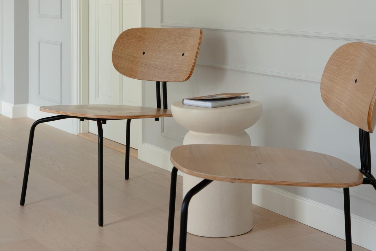 Curious oak veneer armchair with a black base