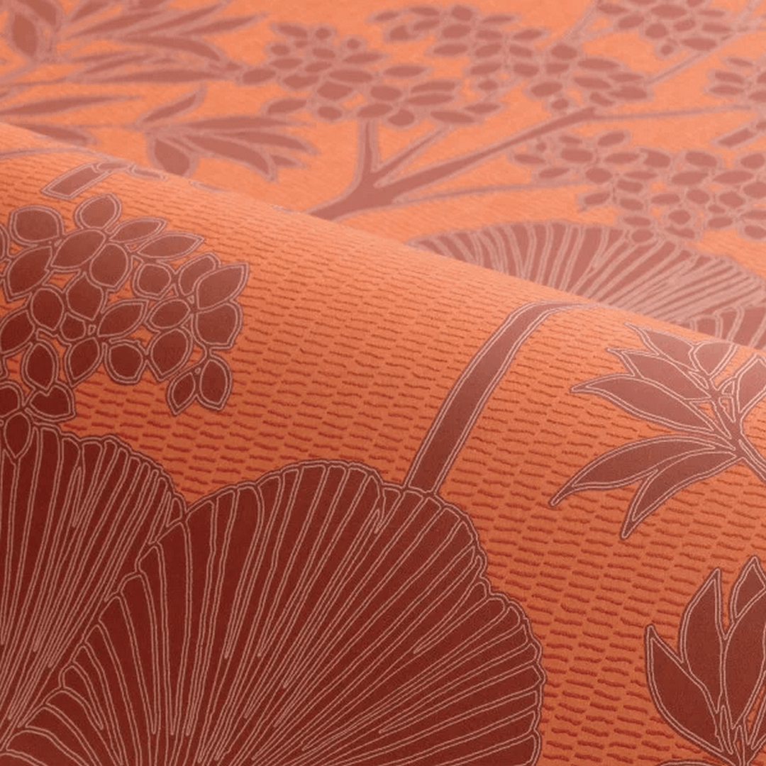 Structural wallpaper with a floral pattern of leaves and flowers INARA - ORANGE BRÛLÉ orange