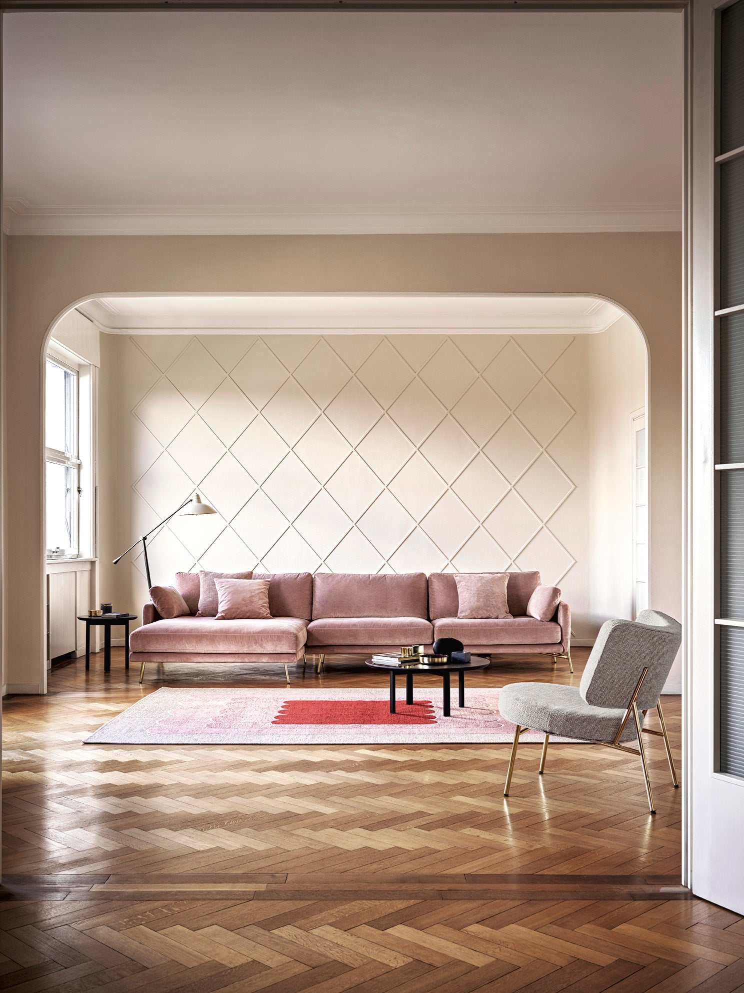 Upholstered COCO armchair with a black base