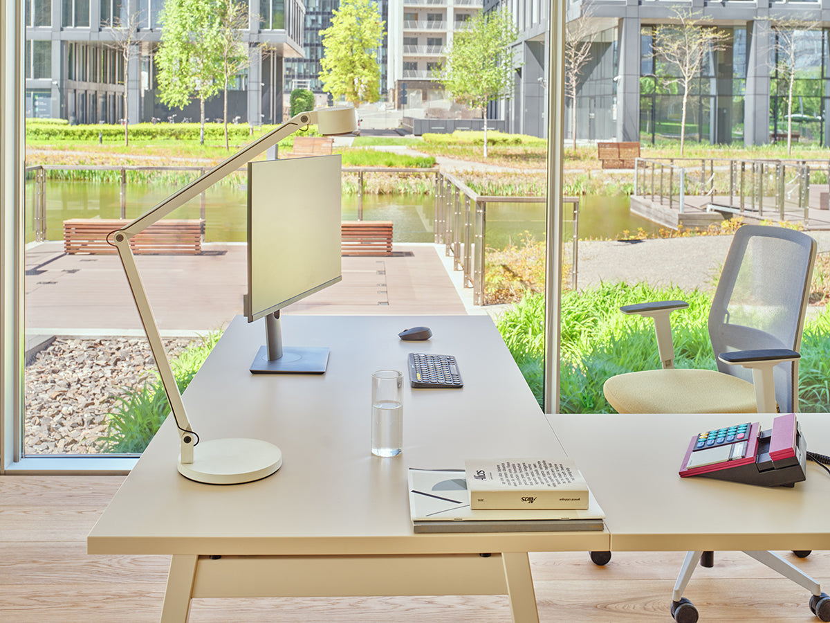 Armchair with an openwork EVO backrest adjustable base with wheels to the hard surface