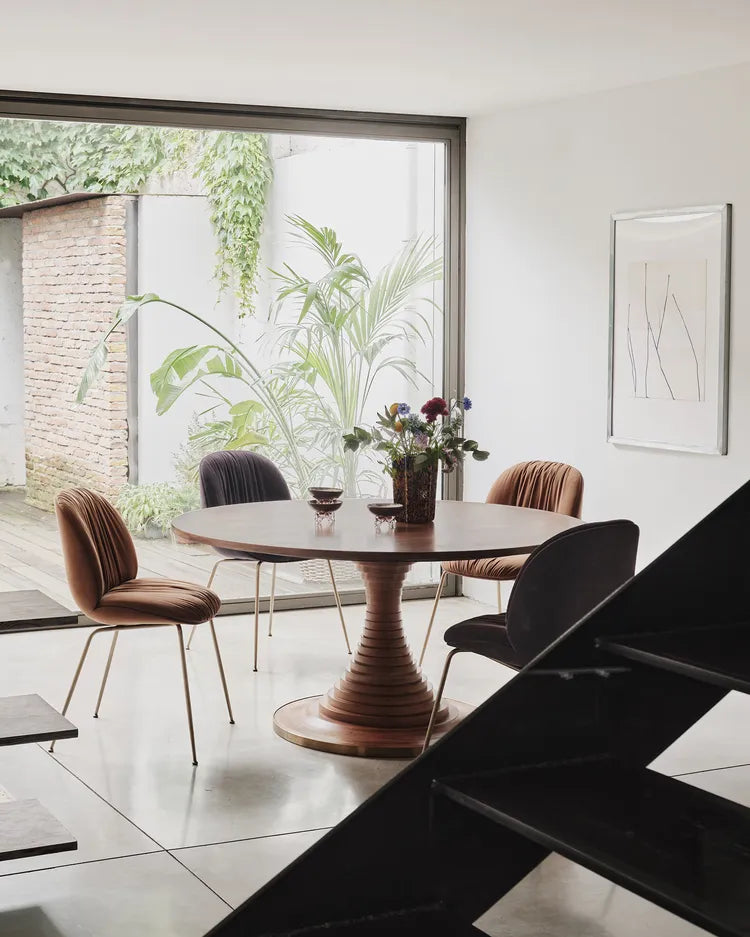 BEETLE SOFT upholstered chair with a brass base