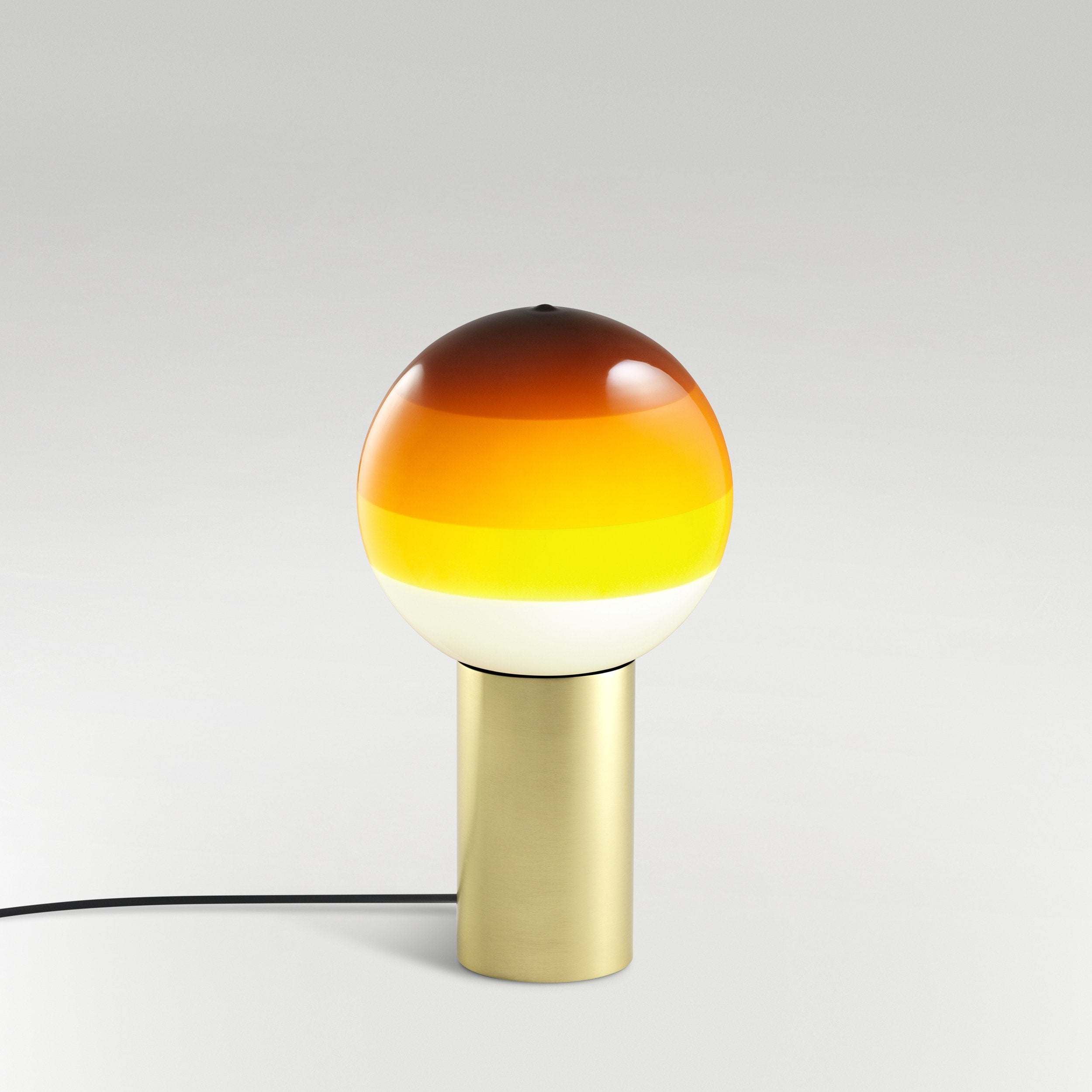 DIPPING amber table lamp with a gold base