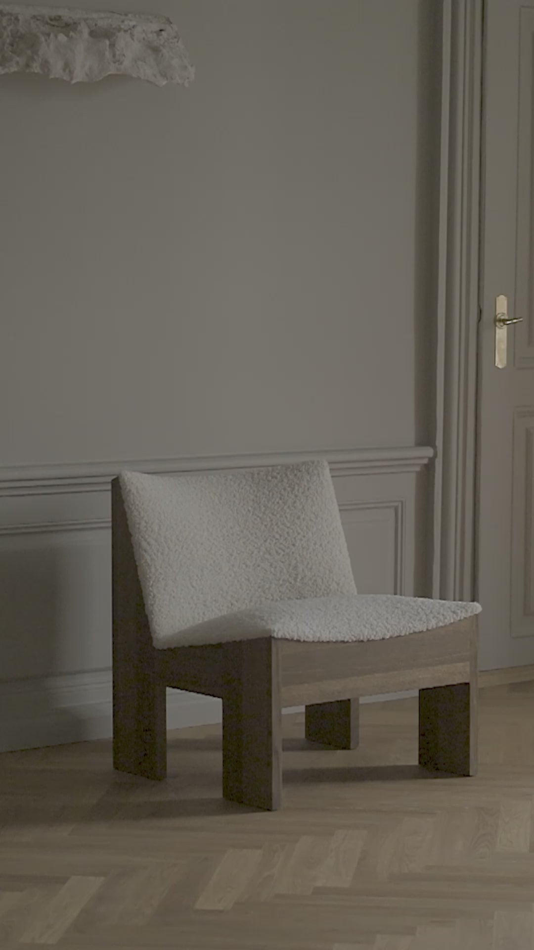 Tenon upholstered armchair with a dark oak base