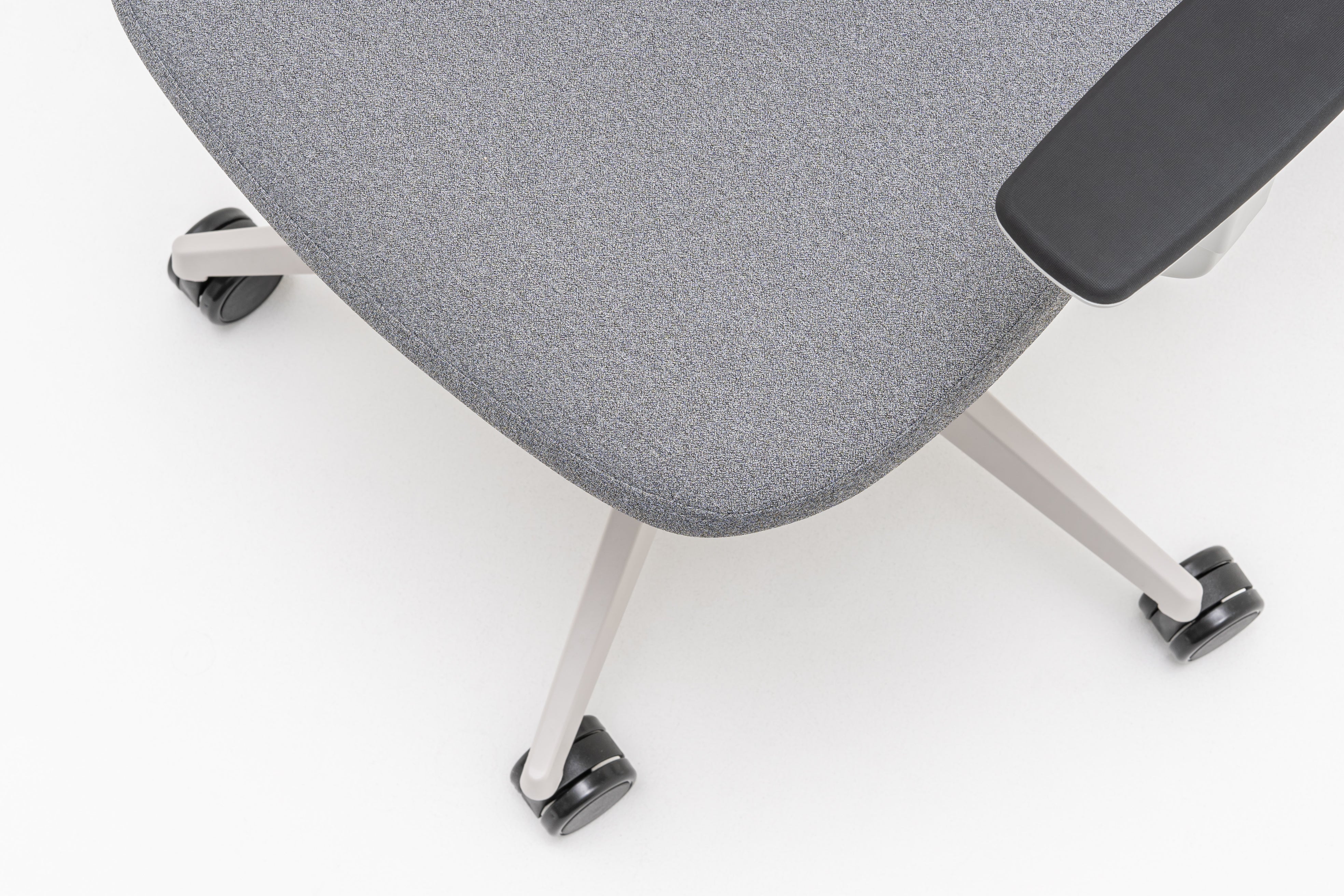 Armchair with an openwork EVO backrest adjustable base with wheels to the hard surface